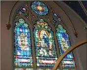  ?? PHOTOS BY PAUL POST ?? Immaculate Conception Church in Hoosick Falls has numerous stained glass windows.