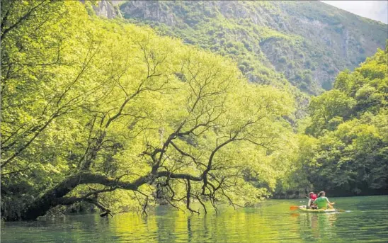  ?? Margo Pfeiff ?? THE NATURAL BEAUTY of Macedonia is one of its chief attraction­s. Here, kayakers explore man-made Lake Matka west of the Macedonian capital city of Skopje.