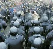  ?? Dmitri Lovetsky Associated Press ?? IN ST. PETERSBURG, police face off with demonstrat­ors in Russia’s biggest protests in five years.
