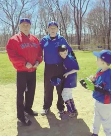  ?? PHOTO COURTESY OF RAY FLYNN ?? PLAY BALL: Rangers coaches Ray Flynn and Steve Reardon, from left, pose with players at Sunday’s opening day of the Challenger Division league.