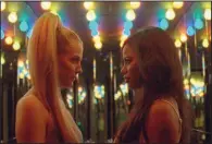  ??  ?? Prostitute Stefani (Riley Keough) and part-time stripper Aziah “Zola” King (Taylour Paige) embark on a crazy cross-country road trip in Janicza Bravo’s Zola, based on a series of real-life tweets.