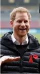  ?? — AFP ?? Duke of Sussex Prince Harry gestures during his visit to the Twickenham Stoop in London on Friday.