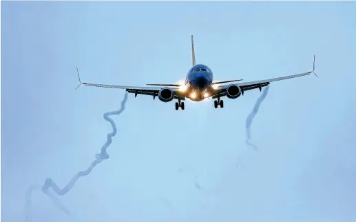  ?? AP ?? A Boeing 737 MAX 8 operated by Southwest Airlines arrives for a landing at Hobby Airport, Houston, in the hours before President Donald Trump’s ban.