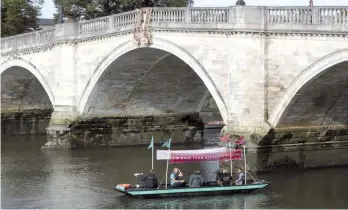  ?? — Reuters ?? PET Project, one of only two boats in the world made from 99 per cent plastic waste, down the River Thames to highlight plastic pollution in UK waterways, in Richmond, south west London on Thursday.