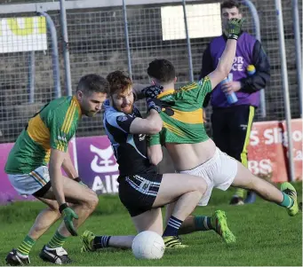  ??  ?? Fiachra Grennan of St John’s fights for possession.