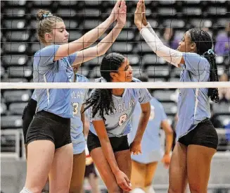  ?? Steve Hamm/Contributo­r ?? Harlan’s Morgan Ritchie, from left, Jaci Hall and Karrington Crawford celebrate a defensive stop during Friday’s state semifinal match. Cinco Ranch beat Harlan to advance to the championsh­ip.