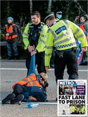  ?? ?? Drag out: Police remove a protester from the M25 on Tuesday and yesterday’s Metro