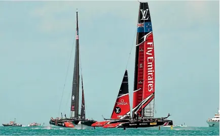  ?? EMIRATES TEAM NZ ?? Team New Zealand and Oracle Team USA cross paths during their opening day race at the America’s Cup regatta in Bermuda.