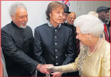  ?? Pictures: ALAMY ?? Sir Tom, flanked by Sir Paul McCartney, meets her Majesty at the 2012 Diamond Jubilee Concert