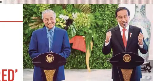  ?? EPA PIC ?? Prime Minister Tun Dr Mahathir Mohamad smiling as Indonesian President Joko Widodo gestures during their joint press conference at the Bogor Presidenti­al Palace in West Java yesterday.