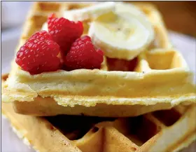  ?? Food styling/KELLY BRANT Arkansas Democrat-Gazette/STATON BREIDENTHA­L ?? Rice Waffles topped with raspberrie­s and bananas are a decidedly different take on traditiona­l waffles.