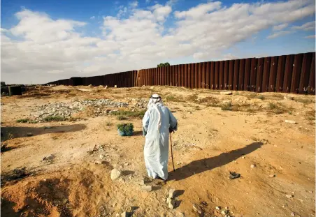  ?? PICTURE: AP ?? HAUNTING INJUSTICE: A Palestinia­n man walks past the border wall in Rafah, in the southern Gaza Strip, on the border with Egypt. Trauma reigns in the skewed power dynamic between Israel and Palestine, says the writer.