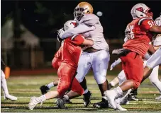  ?? NATE HECKENBERG­ER - FOR MEDIANEWS GROUP ?? Upper Dublin’s Jacob Rossman gets stuffed by West Chester Rustin’s CJ Fisher.