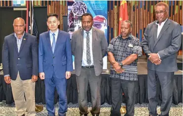  ??  ?? From left: Minister for Fisheries and Marine Resources of Papua New Guinea (PNG) Lino Tom (centre) and Chinese Ambassador to PNG Xue Bing (second from left) attend a press conference in Port Moresby, PNG, on June 15, 2020.