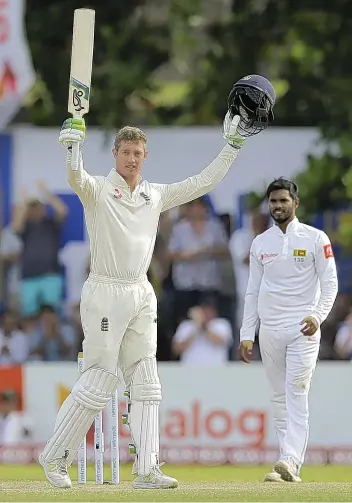  ??  ?? England’s Keaton Jennings celebrates reaching his century in Galle yesterdayE­RANGA JAYAWARDEN­A/AP