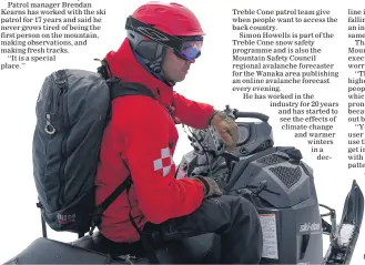  ?? PHOTO CREDIT: RICHARD BIRKBY ?? On patrol . . . Treble Cone skifield patroller Erik Besselman carrying a backpack of explosives to trigger any potential avalanche hazards.