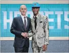  ??  ?? Shai Gilgeous-Alexander turned heads with the flashy floral suit he sported at at the NBA draft in New York on June 21.