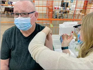  ?? SUBMITTED PHOTO ALBERTA HEALTH SERVICES ?? John Lindsay, born in 1946 and who has lived in Medicine Hat since 2007, is the first person Wednesday to get the COVID-19 vaccine locally.