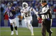  ?? CAROLYN KASTER - THE ASSOCIATED PRESS ?? Los Angeles Chargers defensive back Desmond King (20) rushes the ball past Baltimore Ravens cornerback Anthony Averett in the second half of an NFL wild card playoff football game, Sunday, Jan. 6, 2019, in Baltimore.