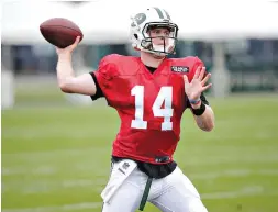  ?? AP Photo/ Seth Wenig ?? ■ New York Jets quarterbac­k Sam Darnold practices Monday during training camp in Florham Park, N.J. Earlier in the day, Darnold—the No. 3 overall draft pick— finalized a four-year, $30.25 million contract with the team.
