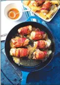  ?? Associated Press photo ?? This photo shows bacon, sage and provolone chicken rolls with marsala