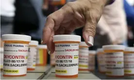  ?? Photograph: Jessica Hill/AP ?? People who have lost loved ones to OxyContin and opioid overdoses leave protest messages written on pill bottles outside the headquarte­rs of Purdue Pharma in Stamford, Connecticu­t on 17 August 2018.
