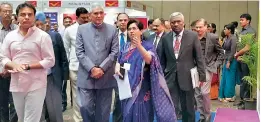  ??  ?? Minister K.T. Rama Rao along with senior IAS officer Shailender Kumar Joshi and other officials takes a look at the Hall of Fame put up at the National e-governance conference being held at HICC on Monday.