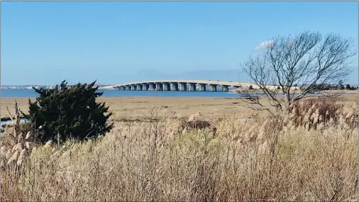  ?? ?? The causeway that connects mainland New Jersey with Long Beach Island loops over the bay west of Cedar Bonnet Island.