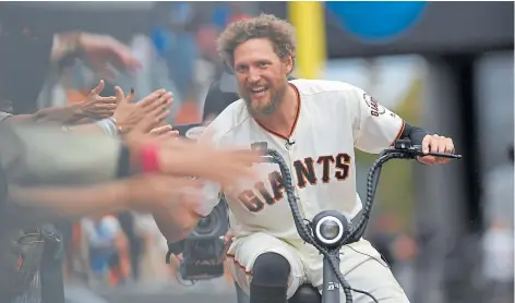  ?? ROBERT REINERS/GETTY IMAGES ?? What better sendoff for what most assumed would be a final hurrah to Hunter than the Giants giving him a cool new scooter and him taking it for a spin around the yard? Will he ride it back into the stadium before the home opener?
