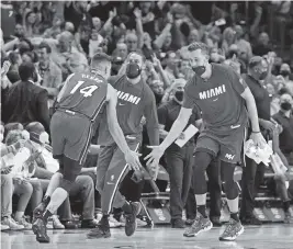  ?? AL DIAZ adiaz@miamiheral­d.com ?? Heat guard Tyler Herro celebrates after hitting a three-pointer before the buzzer at the end of the first quarter against the Milwaukee Bucks at FTX Arena on Thursday.