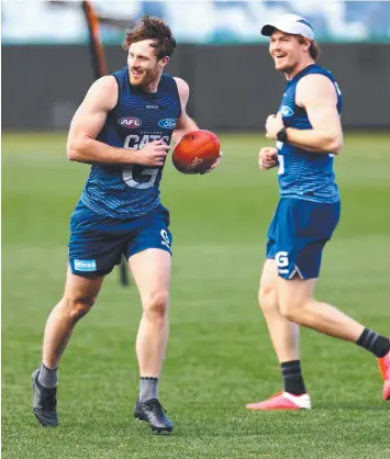  ??  ?? HAPPY CATS: Jed Bews and Gary Rohan at training yesterday.
Picture: GLENN FERGUSON