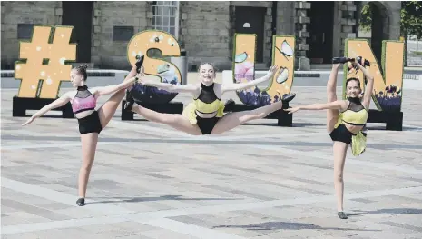  ??  ?? Kathleen Davis Stage School dancers with the #SUN letters at Keel Square.