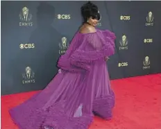  ??  ?? nicole byer in christian siriano Byer looks regal in her custom orchid purple tulle gown.