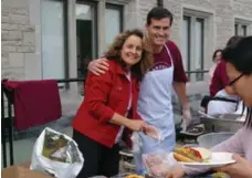  ?? THE BISHOP STRACHAN SCHOOL ?? BSS parents Kim Edwards and David Grant help out at a recent Harvest Games community event on campus.