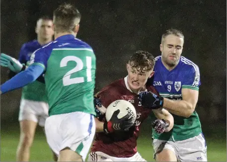  ??  ?? Aaron Maddock of St. Martin’s looks for a gap as Glynn-Barntown duo Kevin Mahoney (21) and Brendan Doyle close down the space.