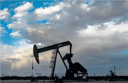  ?? Joel Angel Juarez, © The New York Times Co. ?? An oil well pumps near Loco Hills, N. M., in August. With the acquisitio­n of Concho Resources, ConocoPhil­lips will become a major player in the world’s most lucrative shale field, the Permian Basin.