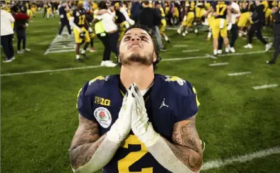  ?? Kyusung Gong/Associated Press ?? Michigan running back Blake Corum gestures after an overtime win against Alabama at the Rose Bowl in an national semifinal game Monday in Pasadena, Calif.