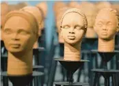  ?? SUNDAY ALAMBA/AP 2022 ?? Rows of sculptures titled Statues Also Breathe are displayed Dec. 13 in Lagos, Nigeria.
