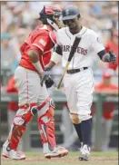  ?? The Associated Press ?? Seattle Mariners’ Dee Gordon reacts after striking out with the bases loaded on a pitch from Los Angeles Angels’ Hansel Robles during the seventh inning Wednesday in Seattle.The Angels won 7-4.