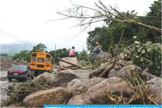  ?? —AFP ?? GOASCORAN, Honduras: View of damages caused by the passage of Tropical Storm Nate, near Goascoran, in Valle department, Honduras.