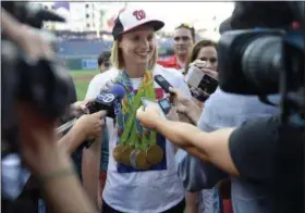  ?? NICK WASS — THE ASSOCIATED PRESS FILE ?? In this Aug., 24, 2016, file photo, Olympic gold-medal swimmer Katie Ledecky talks to the media before a baseball game between the Baltimore Orioles and the Washington Nationals, in Washington. Ledecky shrugs off the notion that she’s doing anything...