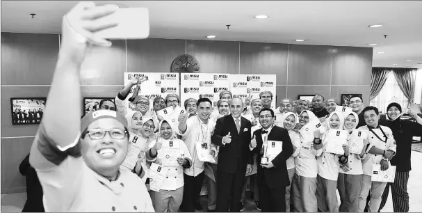  ??  ?? The MSU culinary team in Battle of the Chefs 2018 sharing a proud victory with Professor Tan Sri Dr Mohd Shukri Ab Yajid, MSU President (centre).