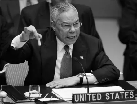  ?? (Ray Stubblebin­e/reuters) ?? US SECRETARY of State Colin Powell holds up a vial that he described as one that could contain anthrax, during his presentati­on on Iraq to the UN Security Council, in New York February, 2003. Powell tried to persuade a skeptical world that Iraq is...