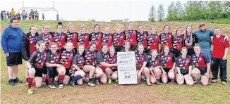  ??  ?? The NRHS Nighthawks and their provincial rugby banner.