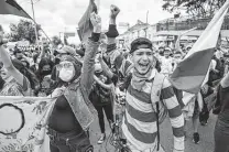  ?? Juan Barreto / AFP via Getty Images ?? People demonstrat­e against the government of Colombian President Ivan Duque on Saturday at Bolivar square in Bogota.