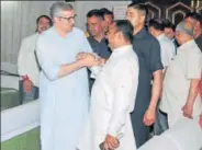  ?? HT ?? Former CM Omar Abdullah meets BJP candidate Vikram Randhawa after casting his vote in the MLC elections in Jammu on April 17.