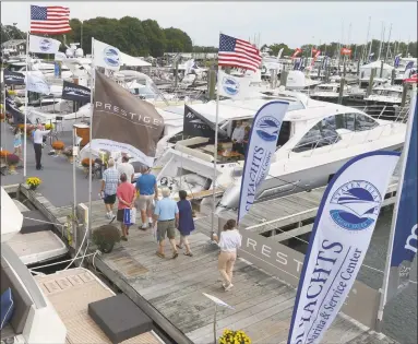  ?? Hearst Connecticu­t Media file photo ?? Visitors stroll the docks at the September 2017 Progressiv­e Insurance Norwalk Boat Show.