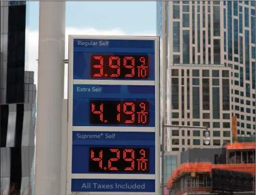  ?? Mark Lennihan/AP ?? Gas prices: In this April 18, 2018, photo, gas prices are displayed at a Mobil station in New York. Crude oil prices are at the highest level in more than three years and expected to climb higher, pushing up gasoline prices along the way.