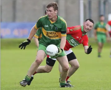  ??  ?? Annacurra’s Paul McDonald looks for options as Rathnew’s Gary Byrne closes in during the SFC.