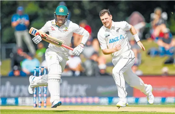  ?? Photo / Photosport ?? Matt Henry (right) and the Black Caps laboured in the field with limited success as Alex Carey batted Australia to victory in the second test.